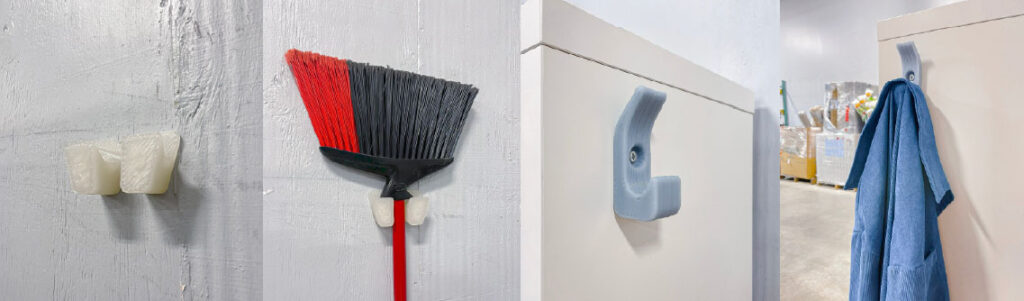 3d printed broom holder and coat hanger in use