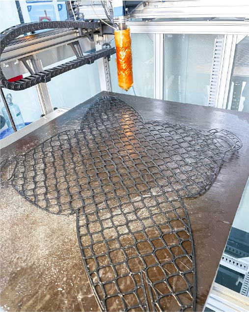 3d printed mesh bag on the printer bed